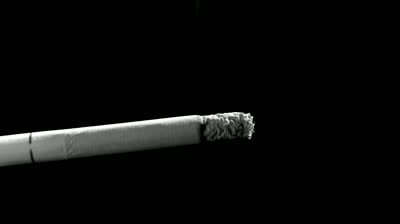 stock-footage-a-burning-cigarette-time-lapse-black-and-white