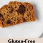 An overhead image of a moist slice of zucchini date bread, arranged on a small, round white plate.