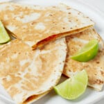 An overhead image of two toasted tortillas, which together create a "sandwich" for a creamy sweet potato filling.