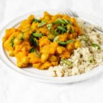 Golden butternut chickpea curry is a fast and flavorful meal—especially when it's served with freshly cooked couscous and chopped green onions.