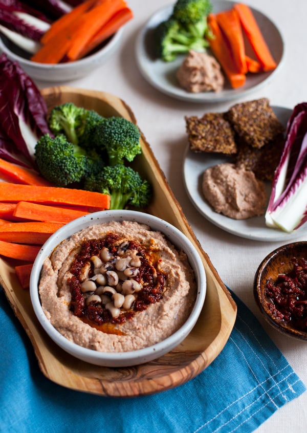 Spicy Harissa Black Eyed Pea Hummus: a new twist on hummus, featuring creamy black eyed peas, spicy harissa paste, and smoked paprika | The Full Helping