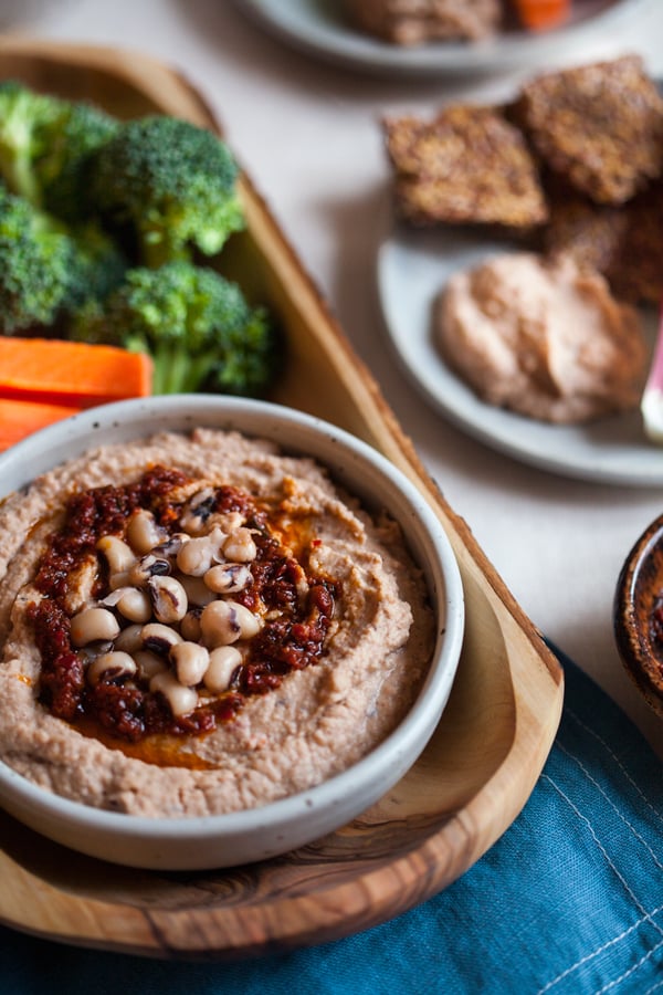 Spicy Harissa Black Eyed Pea Hummus: a new twist on hummus, featuring creamy black eyed peas, spicy harissa paste, and smoked paprika | The Full Helping