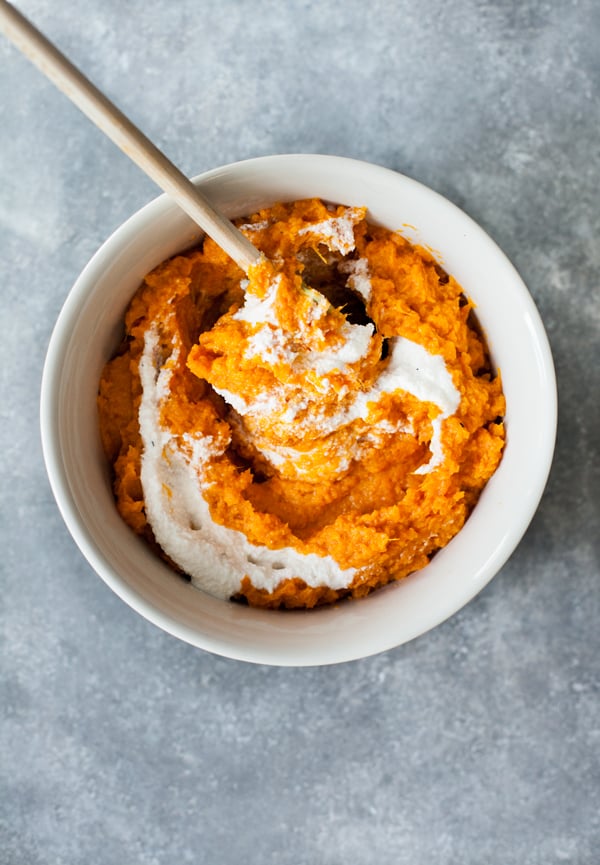 Twice baked, stuffed sweet potatoes with creamy macadamia ricotta: a decadent and festive #vegan side dish! | The Full Helping