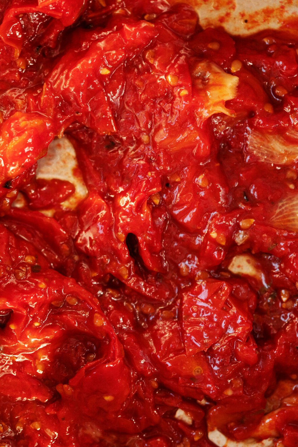 An overhead image of cherry tomato jam, which has been cooked down till it's thick.