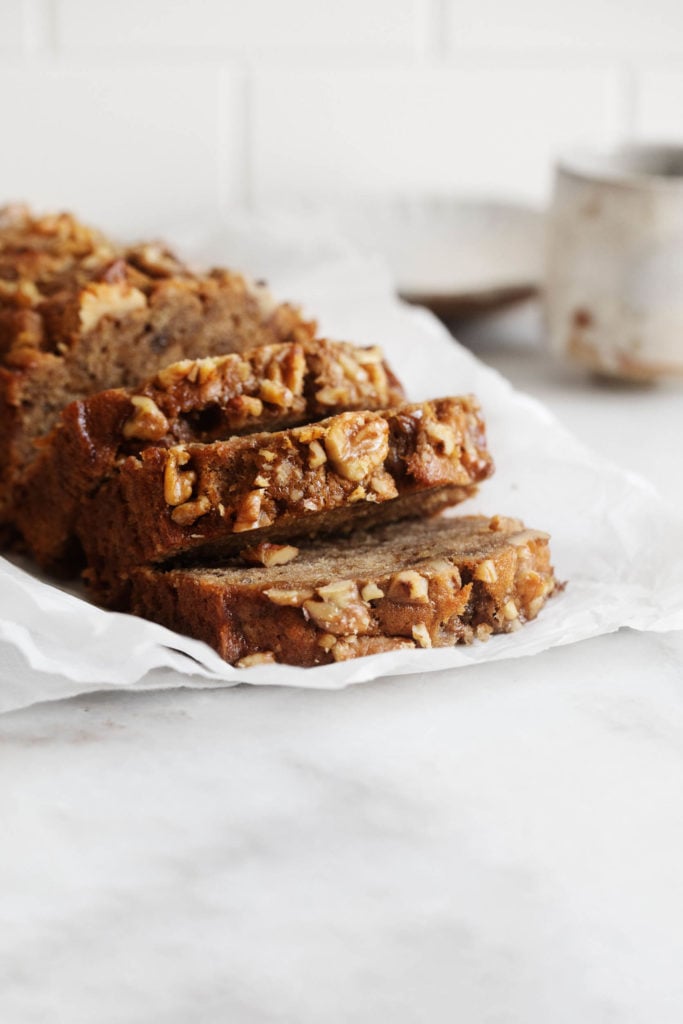 Moist, tender, freshly sliced pieces of classic vegan banana bread, waiting to be eaten.