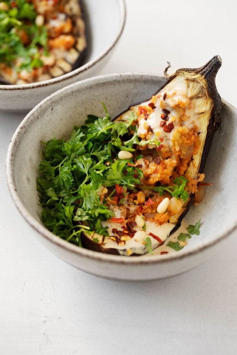 A sumptuous, plant-based stuffed eggplant with bulgur, currants, and pine nuts