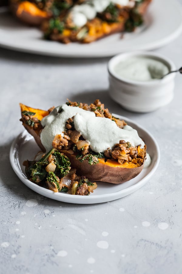 Smoky Lentil Kale Stuffed Sweet Potatoes with Pumpkin Seed Cream