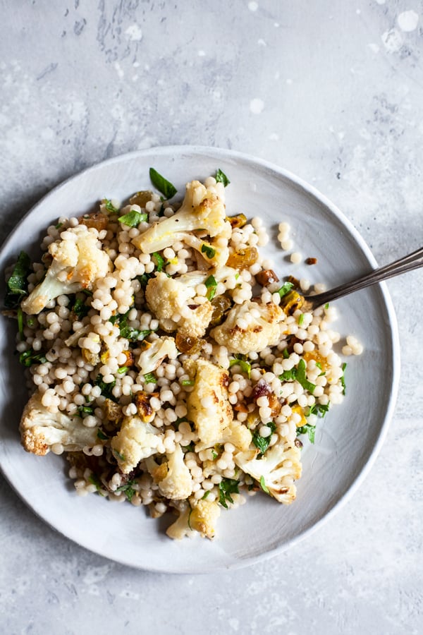 israeli couscous salad with roasted cauliflower, pistachios & dates