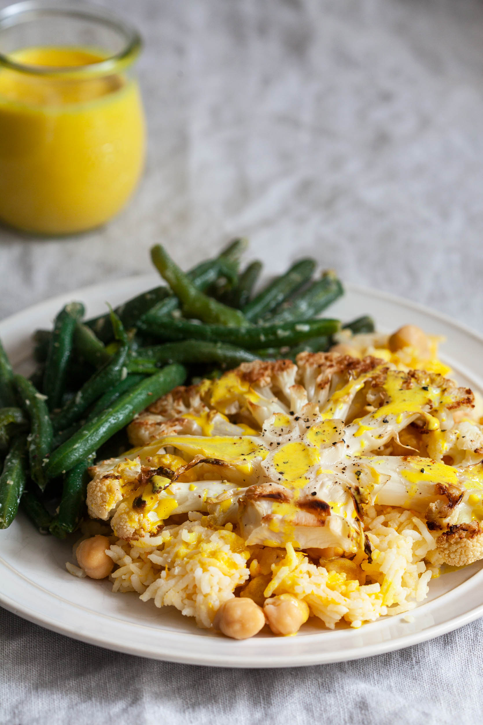 Cauliflower Steaks with Citrus Scented Rice and Creamy Orange Juice Turmeric Sauce | The Full Helping