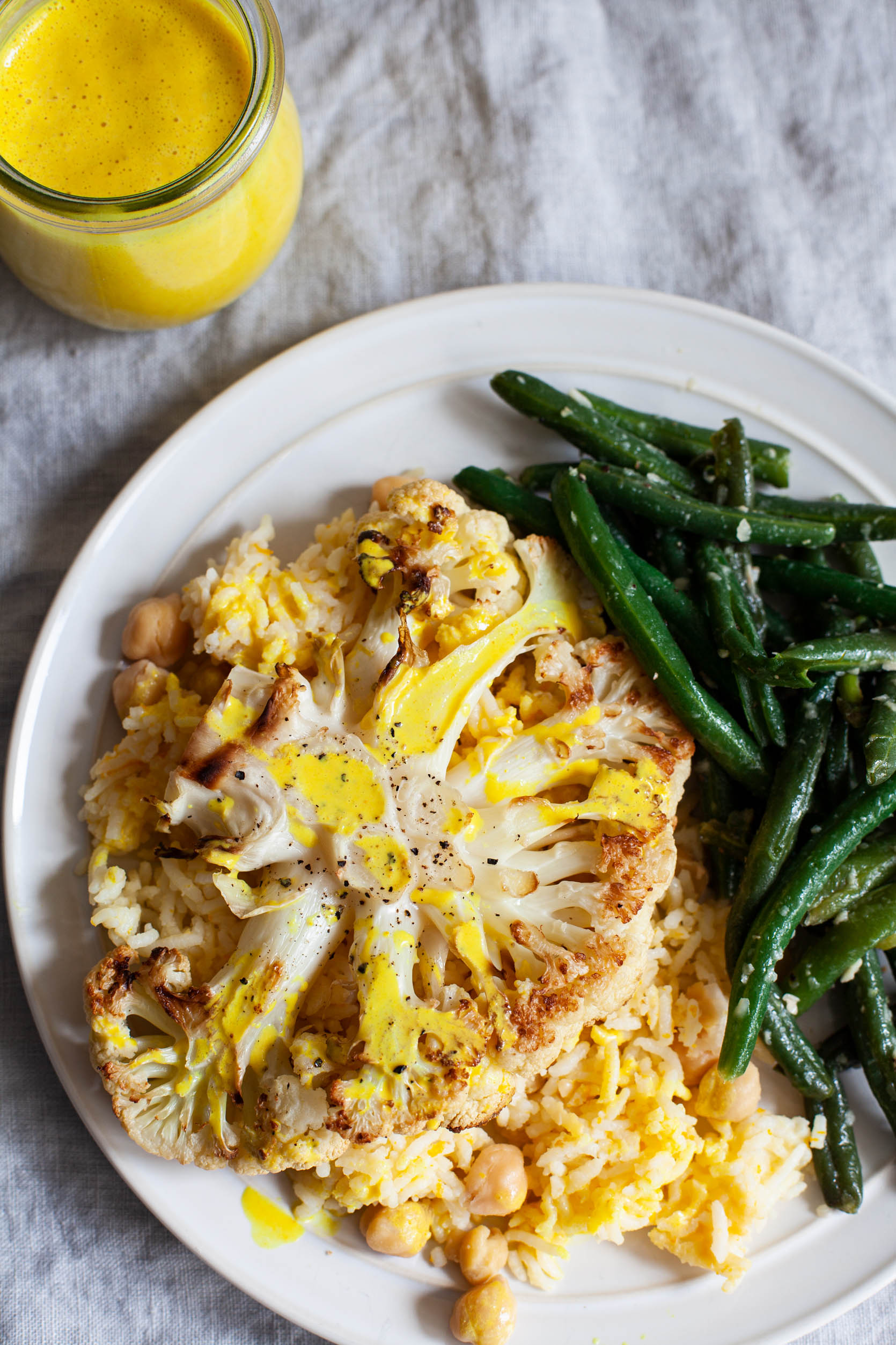 Cauliflower Steaks with Citrus Scented Rice and Creamy Orange Juice Turmeric Sauce | The Full Helping