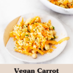 Two small plates hold an orange-hued carrot chickpea couscous salad.