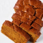 Newly baked pumpkin bread on a white kitchen countertop