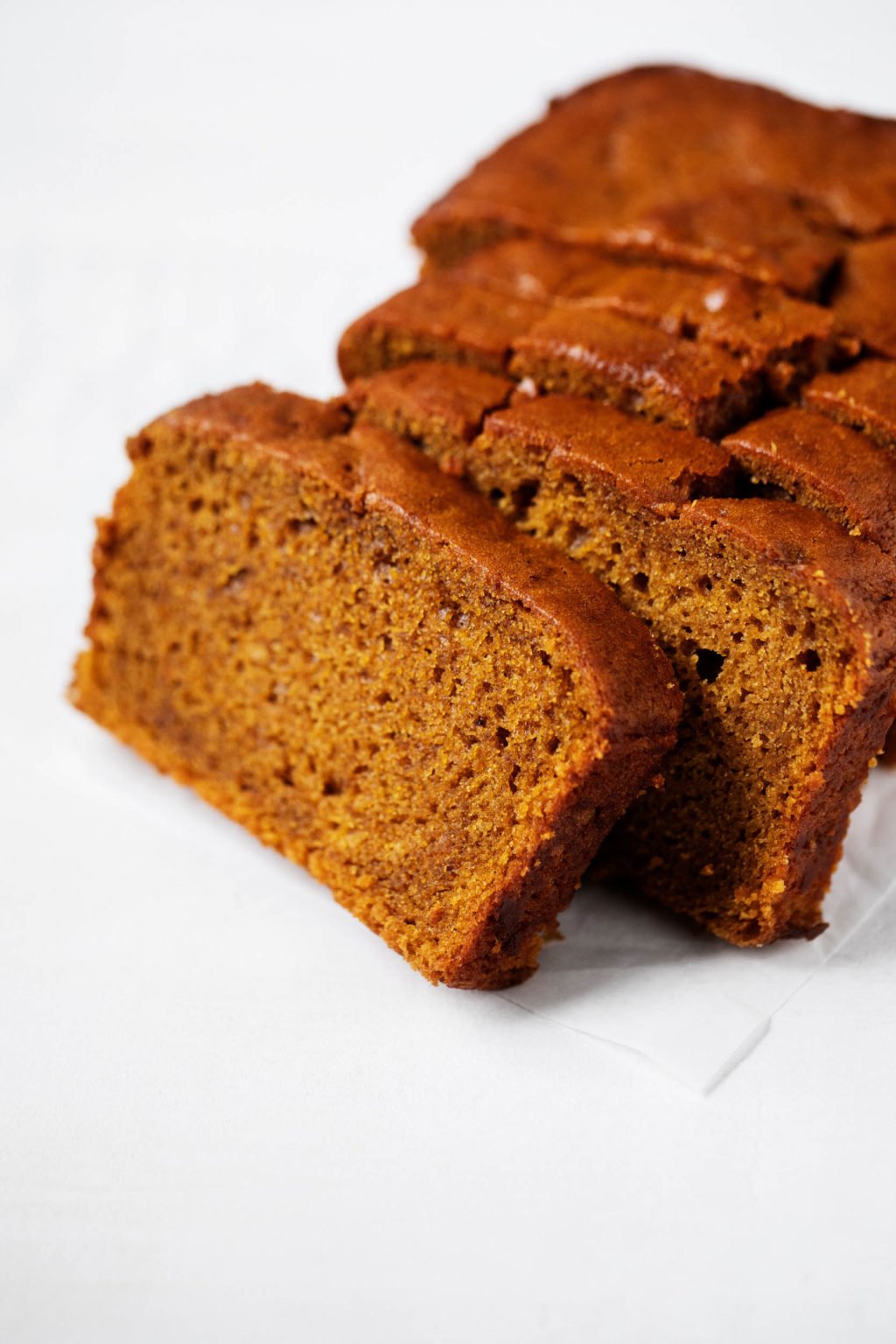 Freshly sliced pieces of classic vegan pumpkin bread.