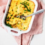 An overhead short of vegan corn pudding, freshly baked in a casserole dish.