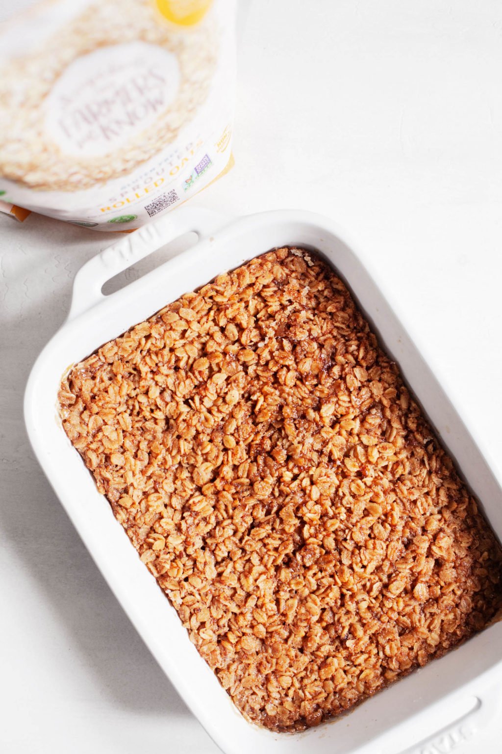 A rectangular baking dish, filled with a whole grain, plant-based breakfast.