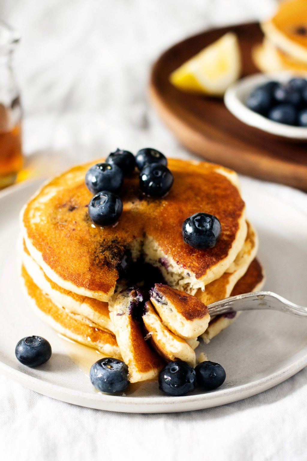 A stack of vegan blueberry cornmeal pancakes.