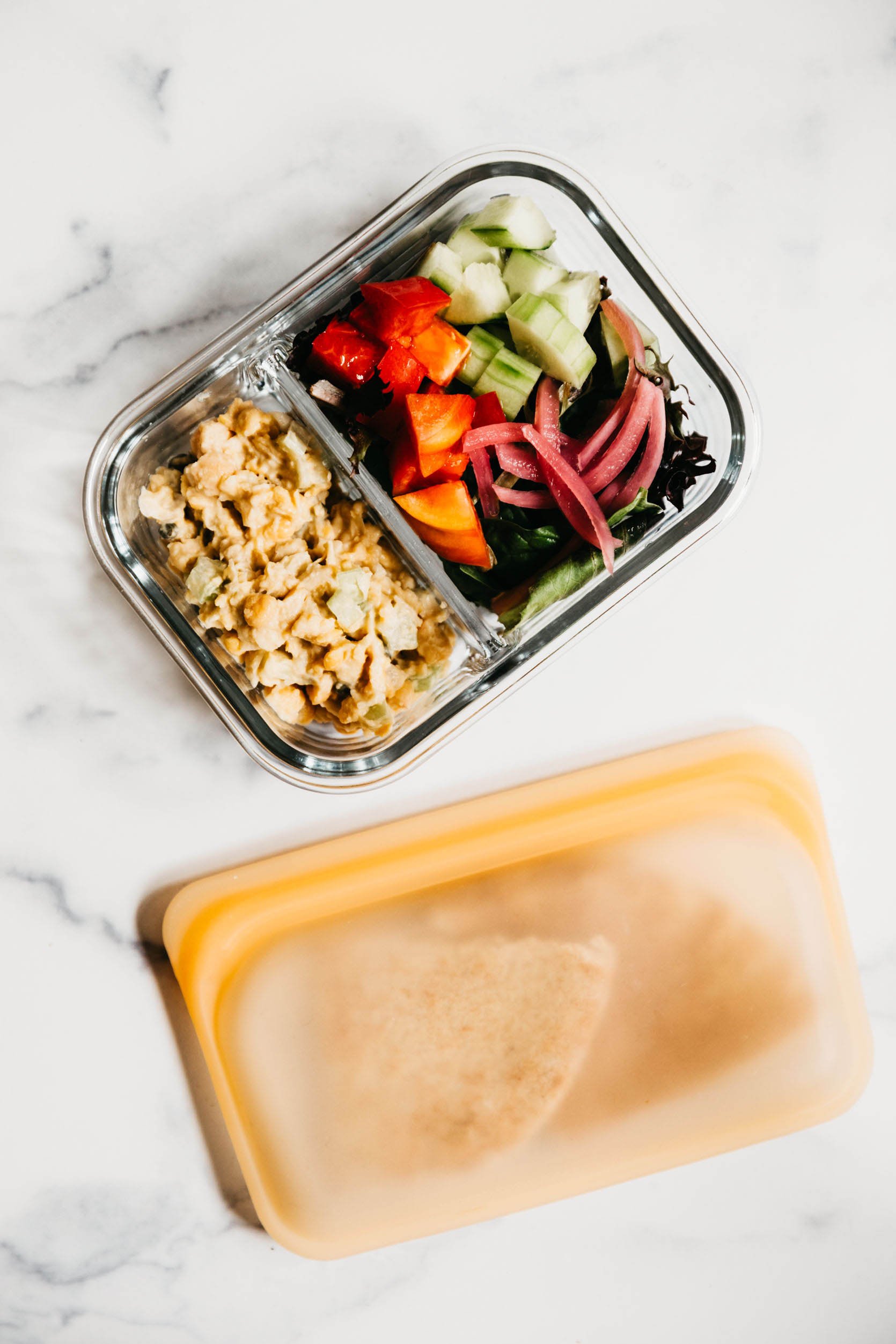 meal prep for the week, four glass containers, filled with corn