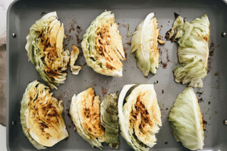 Cabbage wedges with spices are midway through roasting.