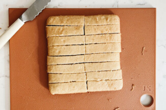 A square cake has been cut into 16 rectangular slices.
