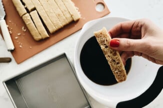 A slice of cake has been quickly submerged in a coffee mixture.