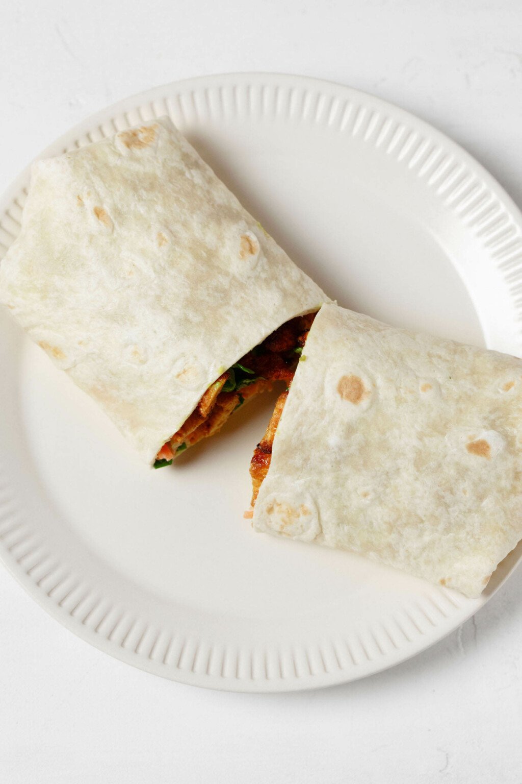 An overhead image of a wrap that has been sliced in half.
