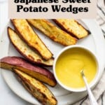 An overhead image of crispy roasted Japanese sweet potato wedges. They're arranged on a white platter with a bright yellow dipping sauce.